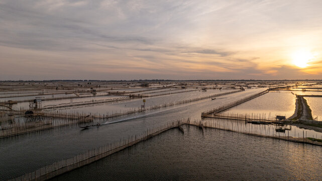 Morning Return of Fishermen at Chuon Lagoon Traditional Fish Trap System, Hue, Vietnam