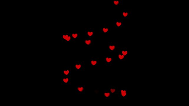 Red hearts rotate around a central axis in a spiral staircase pattern on a black background, creating a romantic depth effect ideal for Valentine promos, intros, overlays, and greetings.