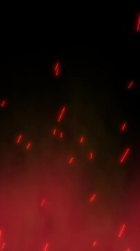 Vertical 4K Glowing red fire sparks and warm embers arise on a dark background. Abstract burning ash particles float upwards through fiery smoke. Dynamic radiant light trails VFX motion loops