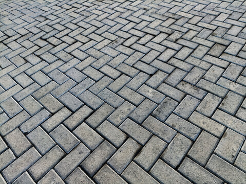 stone block paving. Herrinbone grey paving tile seamless texture