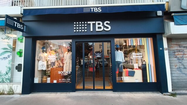 Royan, France - July 15, 2026: Charente-Maritime. Nouvelle-Aquitaine. TBS clothing store exterior with large glass windows displaying apparel and promotional signage in urban setting