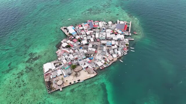 Aerial view of a vulnerable island community in real danger of disappearing due to rising sea levels caused by climate change.