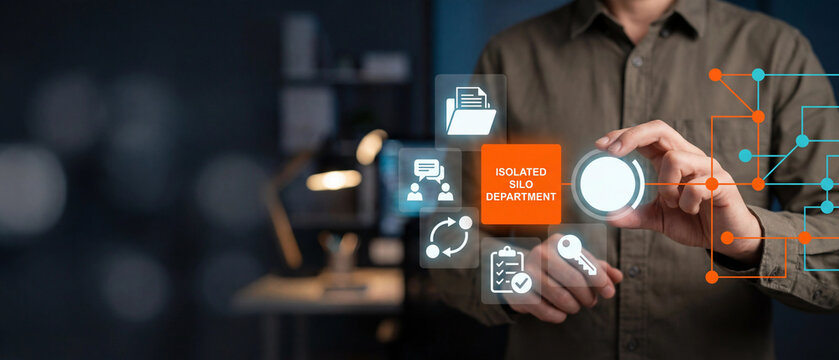 Business professional interacting with a digital interface representing an isolated silo department in a corporate environment