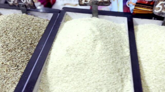 Dry Food Items Including Rice, Maize and Grains Displayed in Grocery Shop Showcasing Fresh Staples for Daily Household Consumption