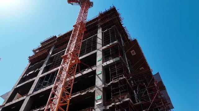 Industrial building construction framework showing steel rebar grid and structural engineering.