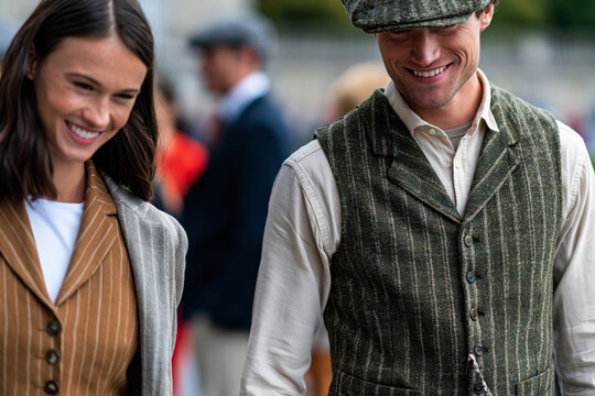 Curated historical fashion collection featuring vintage-inspired garments with refined tailoring, shoppers appreciating timeless style, clean outdoor venue, showcasing incredible natural beauty and