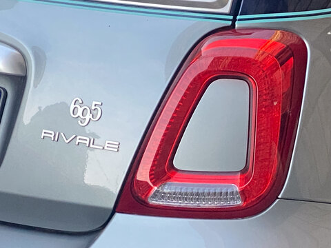 Abarth 695 Rivale car detail, showing the exclusive badging and rear taillight in Cremona, Italy
