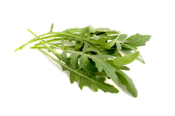 Fototapeta premium Arugula leaves lie on a white background.
