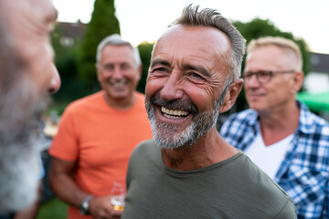 Fototapeta premium Scenic and perfectly framed perspective of Outdoor social gathering with male friends sharing conversation and laughter, natural daylight, clean professional composition., showcasing incredible