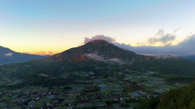 Aerial pullback over Kintamani village and Mount Batur, Bali