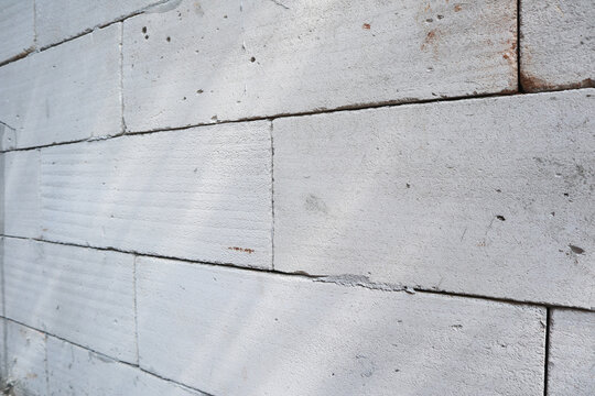 Light gray lightweight concrete block or autoclaved aerated concrete AAC brick