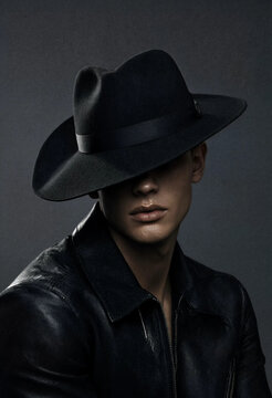 Handsome Man Wearing Black Fedora Hat Close Up Portrait in Shadow