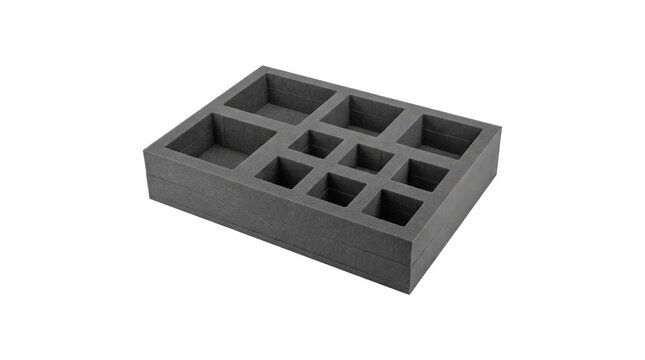 Empty dark grey foam storage tray featuring various square compartments for organized equipment and protective transport