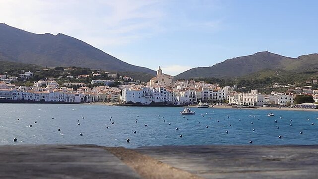 Panoramic view of Cadaques waterfront with traditional white houses and blue sea. The coast of Cadaqu&eacute;s, Spain 09.04.2026