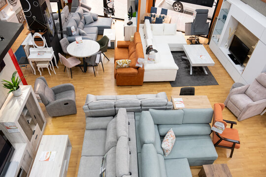 Furniture store interior with various seating arrangements and home decor items