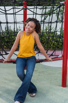 Happy young african american girl laughing on playground