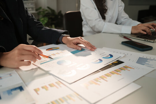 Business professionals analyzing financial data reports