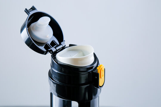 Close-up of the black thermos rim