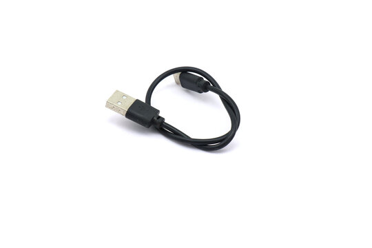 A black USB cable on a white background. A USB cable for data transfer.
