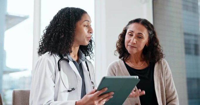 Doctor, consultation and women with tablet in clinic, health and explaining test results to patient. Healthcare, medical professional and discussion with mature person, happy and diagnosis on website