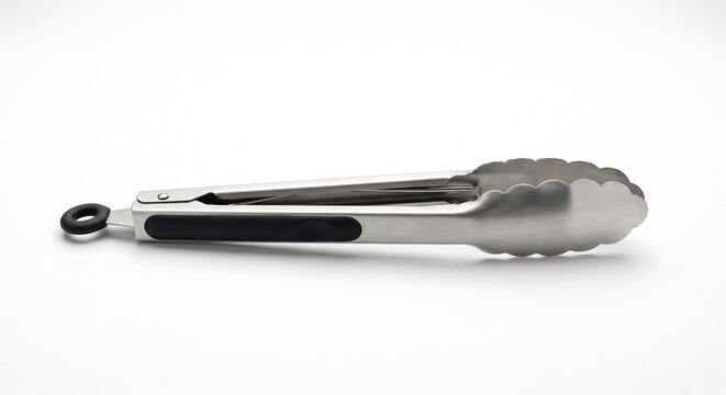 Kitchen Tongs: A pair of stainless steel kitchen tongs with a black grip and scalloped edge, perfect for serving food or flipping ingredients on a griddle.