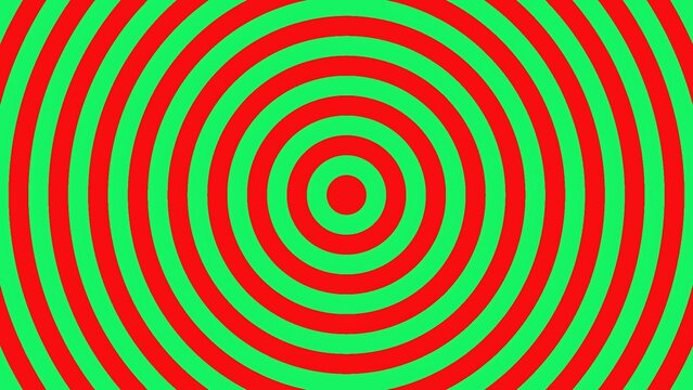 Hypnotic concentric circles pattern background in vibrant red and green colors creating an optical illusion target effect
