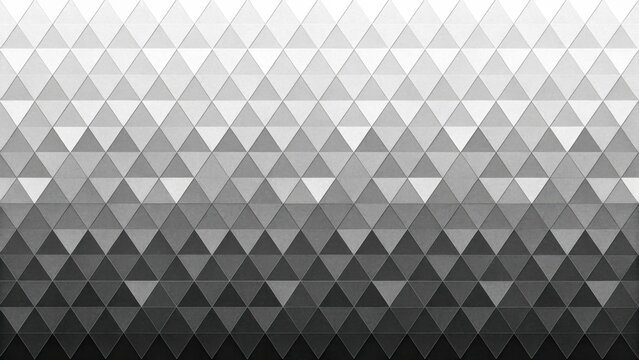 Abstract geometric pattern with grey triangles in a gradient transition from light to dark shades