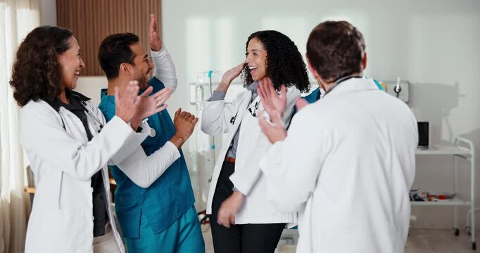 Happy, people and doctor with hands together in hospital for teamwork, mission or success. Excited, group or medical employees piling with smile, stack or high five for winning or clinic achievement