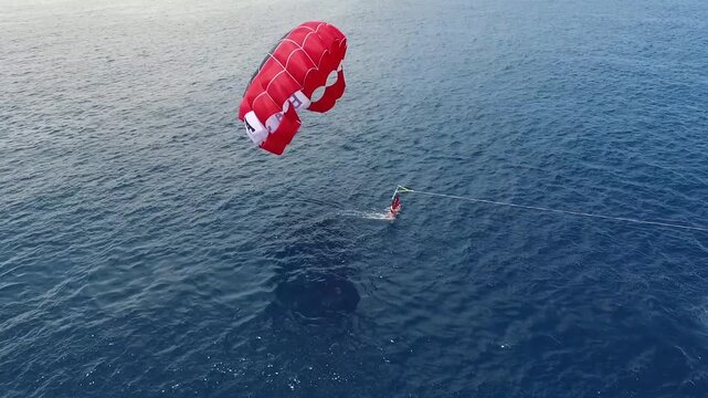 One of the activities offered at Tanjung Benoa in Bali is a parasailing adventure.