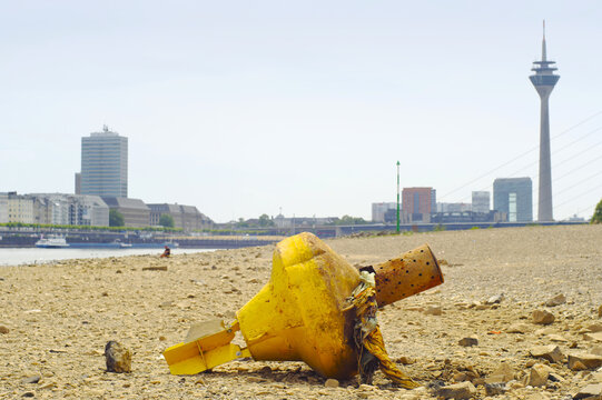 D&uuml;sseldorf, Germany,low stream gauge of rhine river.Water shortage, environmental catastrophe, climate change,global warming concept. Due to the drought buoys are on dry land.