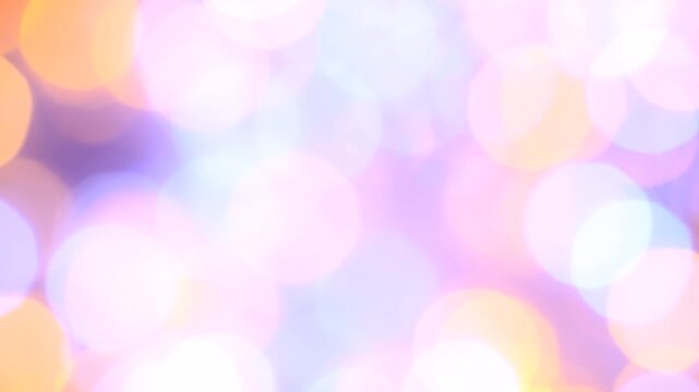 Abstract lights and circles of bokeh in pastel colors slowly moving 
