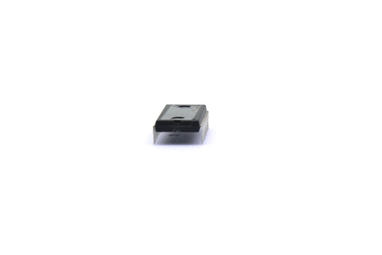 A blurry microcontroller on a white background. An archaic concept of technological advancement.