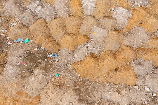 Aerial view of excavated land at Ada Huja featuring piles of sand and soil with scattered construction debris in Belgrade, City of Belgrade, Serbia.