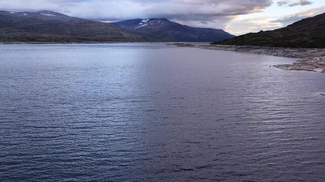 Aerial view showing a worryingly low water level in the Aursjoedammen hydroelectric dam.