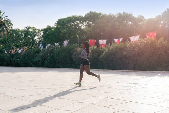 Woman Running in the Park on a Sunny Day 