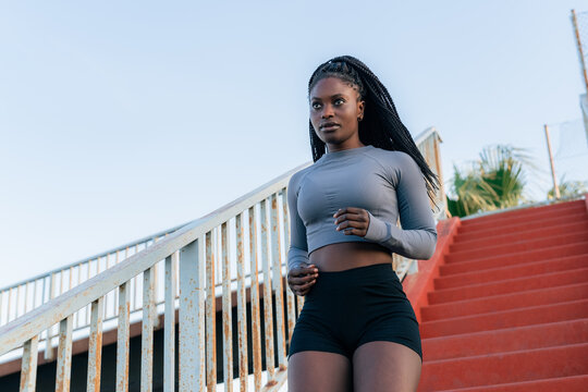 Focused woman is exercising outdoors 