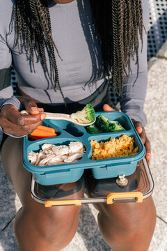 Woman eating healthy food outdoors 
