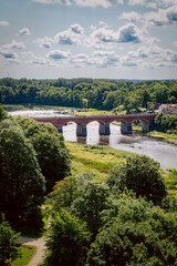 Fototapeta premium The Bridge Over the Venta River in Kuldīga on a Summer Day