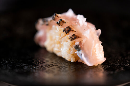 Nigiri sushi with seared fish, salt, and rice