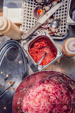 Chef's food prep station with pickled red onions and spices