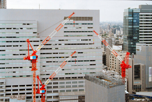 Construction Cranes Work on a Building in Shibuya, Tokyo