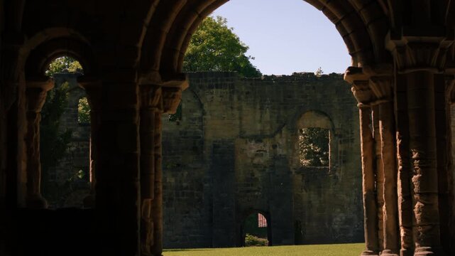 Archway in old Abbey Church ruins in England
