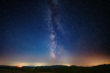 Summer Milky Way stars and landscape scenery silhouettes. © astrosystem