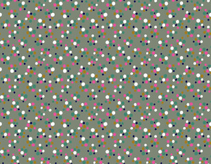 Close-up abstract texture of multicolored polka dots on green fabric background © Wolfworker