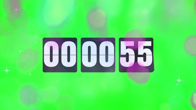 Timer displays fifty-five seconds remaining on a digital clock face that is surrounded by soft glowing bokeh light effects floating against a vibrant green screen background for easy video editing.
