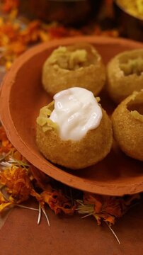 Dahi puri or dahi batashe an indian sweet,tangy and spicy snack