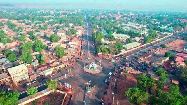 Drone aerial view of major roundabout in Birnin Kebbi Nigeria. Cinematic drone footage overlooking a busy roundabout in Birnin Kebbi, Kebbi State, Nigeria. Wide aerial perspective showing vehicles. 