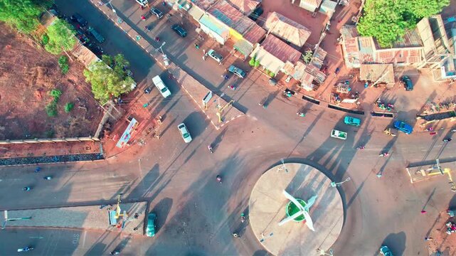 Drone aerial view of major roundabout in Birnin Kebbi Nigeria. Cinematic drone footage overlooking a busy roundabout in Birnin Kebbi, Kebbi State, Nigeria. Wide aerial perspective showing vehicles. 