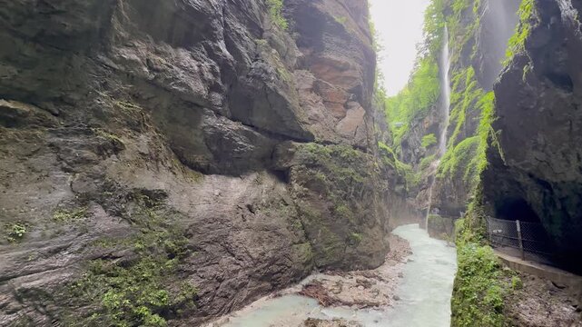 Partnachklamm gorge. Mountain river surrounded by a steep cliff. Popular tourists attraction and hiking area. Garmisch Partenkirchen, Germany