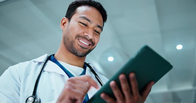 Tablet, doctor and man in hospital for reading schedule, electronic records or review medical report. Happy person, healthcare worker or tech for email, results and scroll case study with low angle
